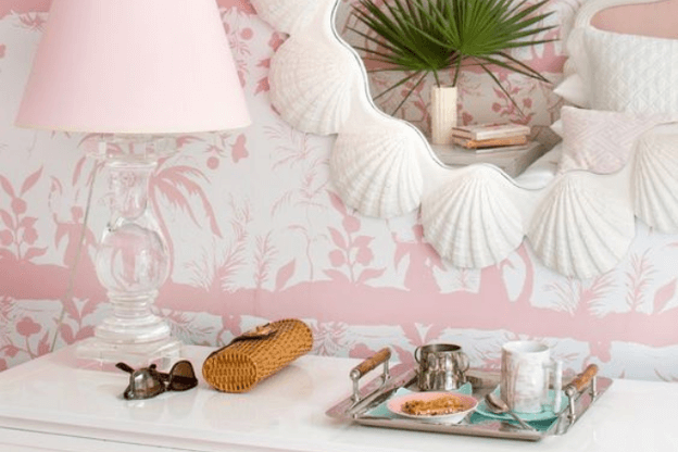 Photo of pink seashell and coastal bedroom to illustrate the mermaidcore home decor trend