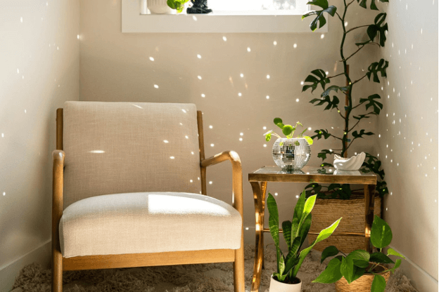 Photo of reading nook decorated with plants and a disco ball to illustrate the jewelry for your home trend