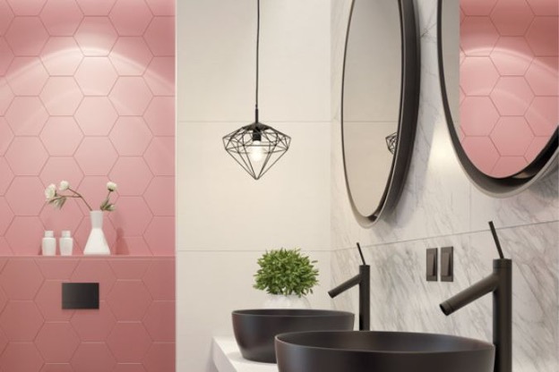Pink wall tile bathroom with double black basin sinks